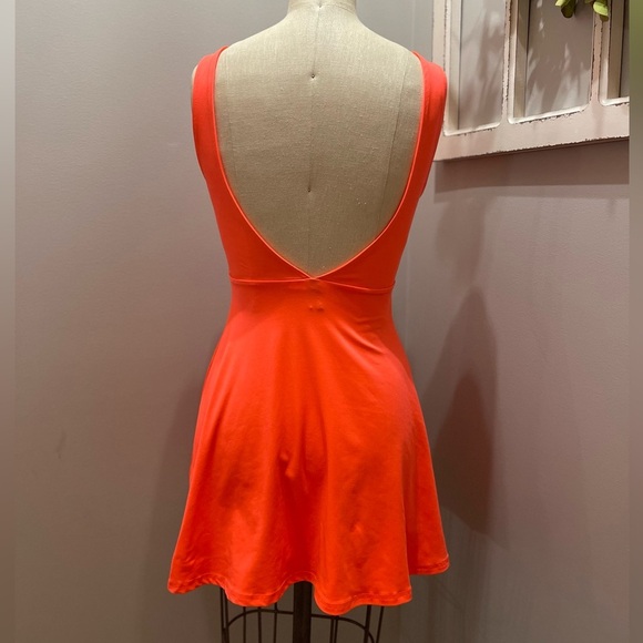 Bright orange mini dress with flared skirt and backless design - Picture 1 of 9
